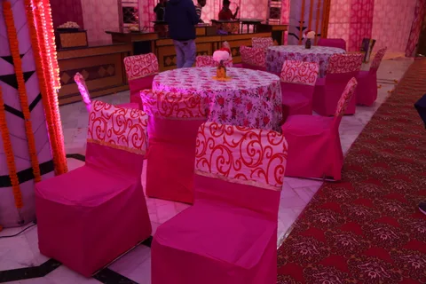 Round tables and chairs with floral covers